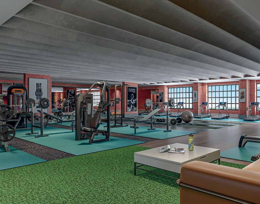 Fully equipped fitness studio with treadmills and free weights