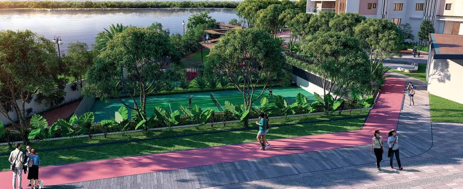 Jogging track alongside Kokapet Lake with a sports court