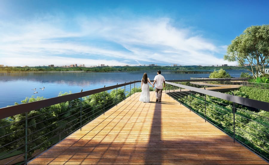 Couple walking on a bridge over Kokapet Lake