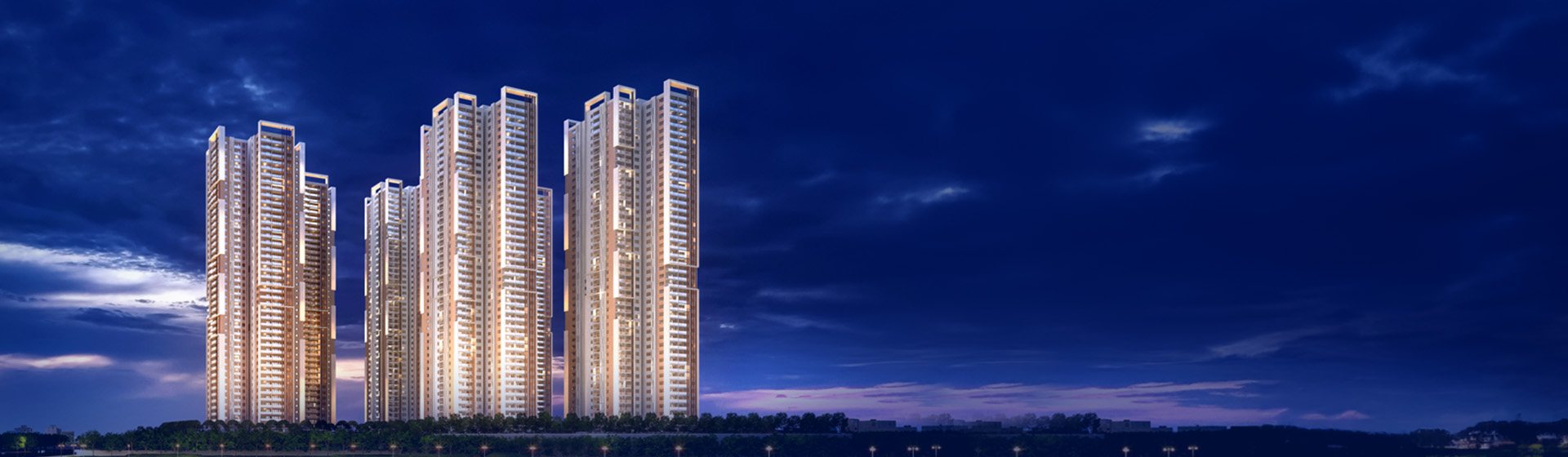 My Home Apas towers at dusk, viewed across Kokapet Lake
