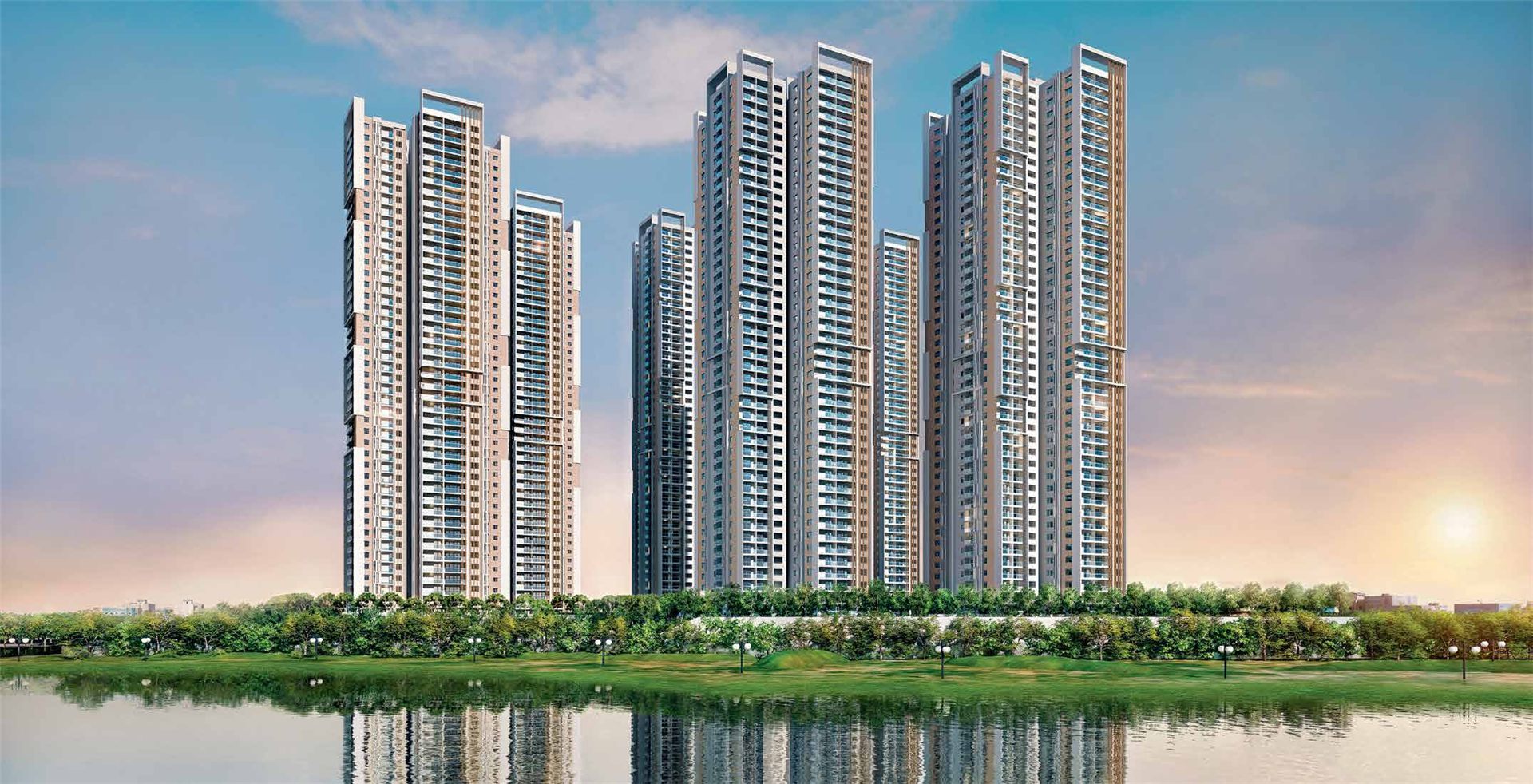 My Home Apas towers at golden hour, viewed across Kokapet Lake