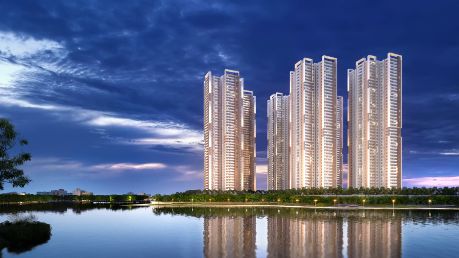 My Home Apas towers at dusk, viewed across Kokapet Lake