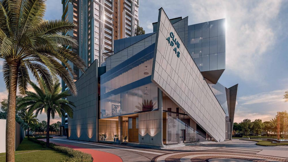 Club Apas tower facade lit up at dusk